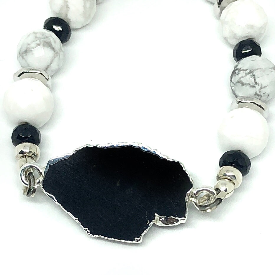 Close-up of black tourmaline focal and surrounding beads in black, white, gray, and silver "Lake Moon" bracelet from STARSNOW Collection